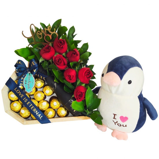Peluche Pinguino Encantador con chocolates y espumante Freixenet