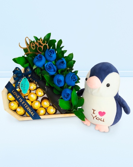 Peluche Pinguino Encantador con chocolates y espumante Freixenet